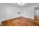 Bedroom featuring hardwood floors, a window, and closet at 1069 21St N Ave, St Petersburg, FL 33704