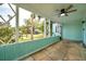 View of the enclosed front porch with stone floor and open feel at 1069 21St N Ave, St Petersburg, FL 33704