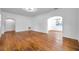 Spacious living room with hardwood floors, arched doorways, and ample natural light at 1069 21St N Ave, St Petersburg, FL 33704