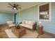 Inviting outdoor porch area with comfortable seating and a ceiling fan, perfect for relaxing at 1069 21St N Ave, St Petersburg, FL 33704