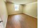 Bedroom view with wood flooring and large window providing lots of natural light at 107 Caldwell Dr # 178M, Brandon, FL 33510