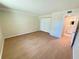 Spacious bedroom featuring wood flooring, double closets, overhead lighting and bathroom entrance at 107 Caldwell Dr # 178M, Brandon, FL 33510
