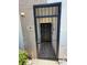 Close-up view of a gated entryway with decorative metalwork and address number for added security at 107 Caldwell Dr # 178M, Brandon, FL 33510