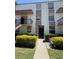 Two-story condo with gated entry, manicured bushes and neutral color scheme for a contemporary look at 107 Caldwell Dr # 178M, Brandon, FL 33510