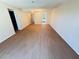 Spacious living room with hardwood floors and view to other rooms at 107 Caldwell Dr # 178M, Brandon, FL 33510
