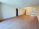 Open-concept living area showcasing hardwood floors, and access to kitchen and other rooms at 107 Caldwell Dr # 178M, Brandon, FL 33510