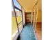 Enclosed porch features open windows to the green landscape and a storage area for personal items at 107 Caldwell Dr # 178M, Brandon, FL 33510