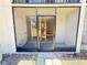 View of an enclosed porch from outside the unit, a secure entry point with added safety at 107 Caldwell Dr # 178M, Brandon, FL 33510
