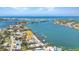 Aerial view displays home's bay access and neighborhood location at 107 Sunset Dr, Nokomis, FL 34275