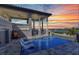 Stunning poolside view featuring an in-pool lounge, covered patio and beautiful inter-coastal views at 107 Sunset Dr, Nokomis, FL 34275