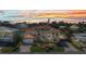 A grand two-story home featuring lush landscaping, a brick driveway and an attached two-car garage at 107 Sunset Dr, Nokomis, FL 34275