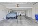 Spacious garage with ample storage and a vehicle parked inside at 107 Sunset Dr, Nokomis, FL 34275