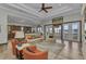 Spacious living room with modern decor, water views, and easy access to the kitchen at 107 Sunset Dr, Nokomis, FL 34275