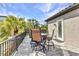 Outdoor patio featuring a table and chairs, perfect for enjoying the weather at 107 Sunset Dr, Nokomis, FL 34275