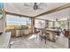 Inviting outdoor patio boasts modern grill, dining table, and comfortable seating area at 107 Sunset Dr, Nokomis, FL 34275