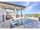 Stunning backyard features a modern pool, lounge chairs, and waterfront views at 107 Sunset Dr, Nokomis, FL 34275