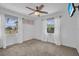 Bedroom featuring carpet flooring, natural light, and a ceiling fan at 11015 S County Road 39, Lithia, FL 33547