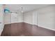 Bedroom featuring hardwood floors and a tv at 11015 S County Road 39, Lithia, FL 33547