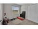 Bedroom with neutral carpet, a window, and closet for storage at 11015 S County Road 39, Lithia, FL 33547