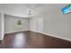 Spacious bedroom with hardwood floors and a window overlooking the lawn at 11015 S County Road 39, Lithia, FL 33547