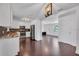 Well-lit, upgraded kitchen with stainless steel appliances, and dark wood flooring at 11015 S County Road 39, Lithia, FL 33547