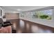 Bright living room with hardwood floors and great views from many windows at 11015 S County Road 39, Lithia, FL 33547