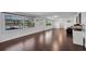 Bright living room with hardwood floors, windows overlooking pool and large backyard at 11015 S County Road 39, Lithia, FL 33547