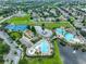 Aerial view showcasing community amenities including pools, a playground, and tennis courts at 11029 Winter Crest Dr Dr, Riverview, FL 33569