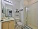White bathroom featuring a glass enclosed shower, neutral vanity, and tile floors at 11029 Winter Crest Dr Dr, Riverview, FL 33569