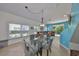 Bright dining area with a modern table, gray chairs, and a view of the backyard at 11029 Winter Crest Dr Dr, Riverview, FL 33569