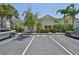 Exterior view of a light-colored townhouse with visitor parking spots available at 11029 Winter Crest Dr Dr, Riverview, FL 33569