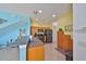 This kitchen shows stainless steel appliances, wooden cabinets, and a breakfast bar at 11029 Winter Crest Dr Dr, Riverview, FL 33569