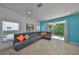 A grey sectional couch in a bright room with a glass patio door at 11029 Winter Crest Dr Dr, Riverview, FL 33569