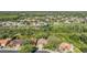 Expansive aerial view of a neighborhood with mature trees, ponds, and well-maintained homes at 1119 Hounds Run, Safety Harbor, FL 34695