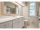 Bright bathroom features quartz counters and a tiled shower/tub combo at 1119 Hounds Run, Safety Harbor, FL 34695