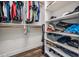 Organized walk-in closet with shelving, hanging racks, and ample storage space at 1119 Hounds Run, Safety Harbor, FL 34695