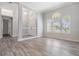 Inviting living space with wood-look floors, large windows, and an open layout at 1119 Hounds Run, Safety Harbor, FL 34695