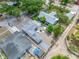 Aerial view of a well-maintained property with a spacious backyard, detached garage, and convenient driveway at 1120 45Th N St, St Petersburg, FL 33713