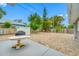 Home's backyard features stone landscaping with a patio and outdoor grill at 1120 45Th N St, St Petersburg, FL 33713