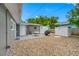 Home's backyard features stone landscaping with a patio and outdoor grill at 1120 45Th N St, St Petersburg, FL 33713