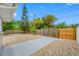 Fenced backyard with a small concrete patio and gravel groundcover for low maintenance and a natural aesthetic at 1120 45Th N St, St Petersburg, FL 33713
