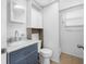 Bathroom vanity featuring marble countertop, built-in storage, and step-in shower at 1120 45Th N St, St Petersburg, FL 33713