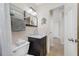 Cozy bathroom featuring a modern vanity with marble countertop and decorative shelving at 1120 45Th N St, St Petersburg, FL 33713