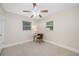 Well-lit bedroom with a ceiling fan and plenty of natural light from two windows at 1120 45Th N St, St Petersburg, FL 33713