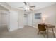 Bedroom with ceiling fan, closet, and a quaint desk area at 1120 45Th N St, St Petersburg, FL 33713