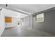 Spacious garage interior with concrete flooring, and natural light at 1120 45Th N St, St Petersburg, FL 33713