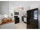 Kitchen with black appliances, butcher block countertop, and gray cabinets at 1120 45Th N St, St Petersburg, FL 33713