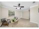 Spacious living room featuring ceiling fan, neutral colors, and ample natural light at 1120 45Th N St, St Petersburg, FL 33713