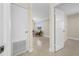 View of the living room with neutral paint and flooring through a doorway at 1120 45Th N St, St Petersburg, FL 33713