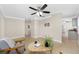 Open living space with ceiling fan, neutral colors, and view into the kitchen at 1120 45Th N St, St Petersburg, FL 33713